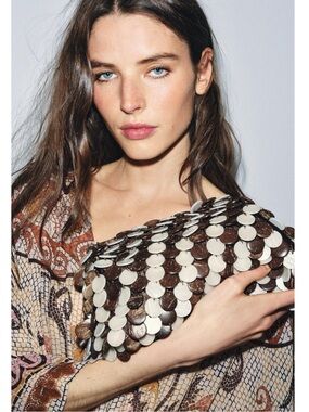 Zara Appliqué Pouch Bag featuring a brown and white shell-like design.